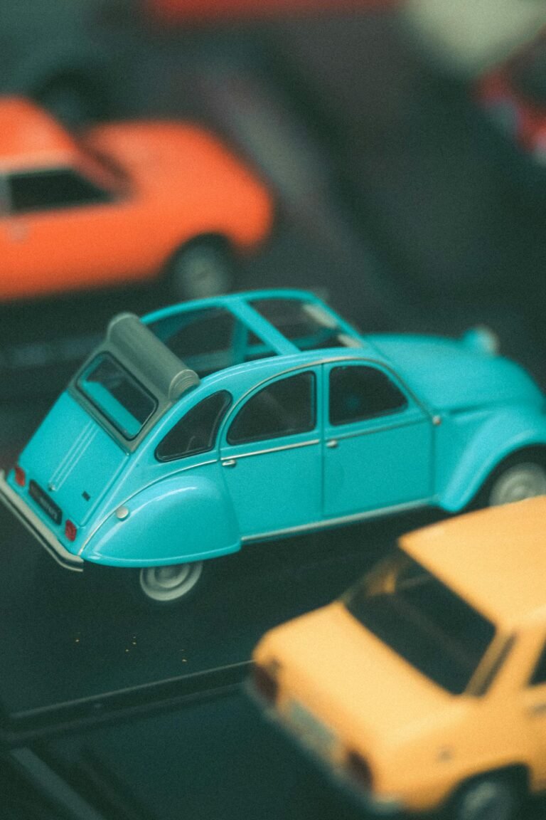 Vibrant miniature vintage car models arranged in a stylish still life.
